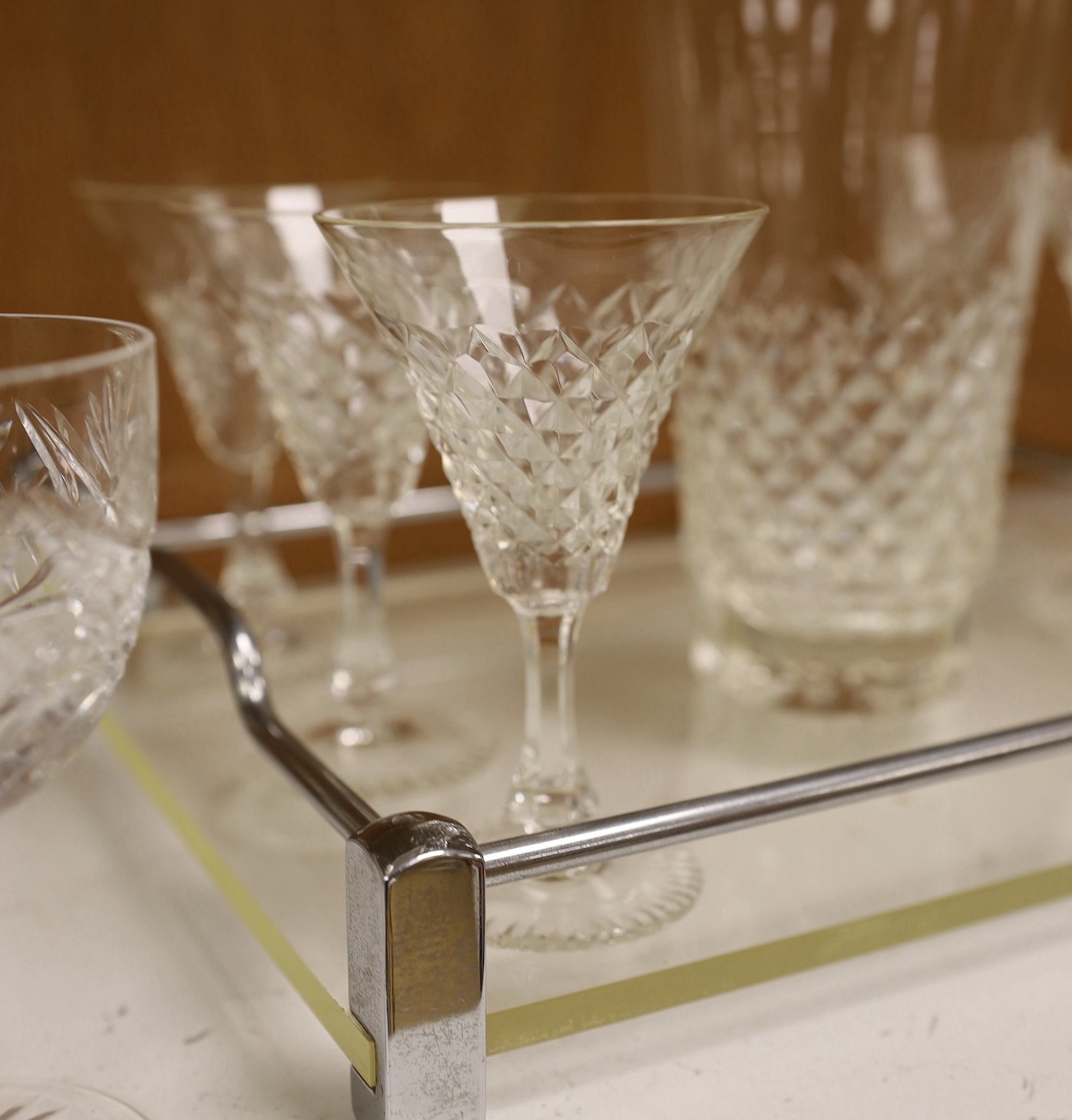 A mid century chrome and perspex drinks tray with 6 cocktail glasses, mixing glass and 8 wine glasses